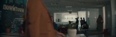 a group of people walking down a hallway