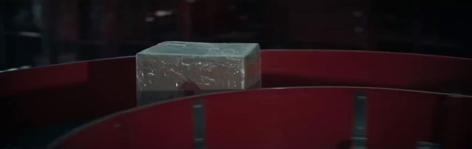 a white box sitting on top of a red chair