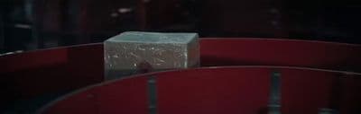 a white box sitting on top of a red chair