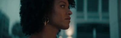 a close up of a person wearing earrings