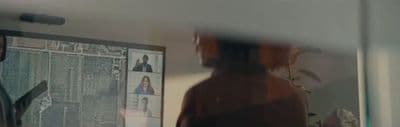 a man standing in front of a mirror in a room