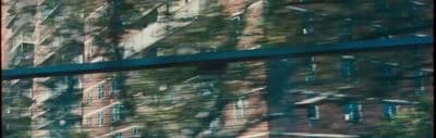 a reflection of a building in a window