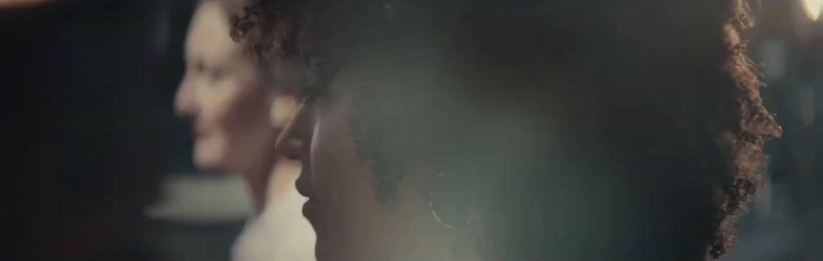 a close up of a woman's head in a mirror