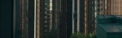 a tall building with a clock on the side of it