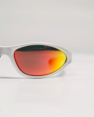 a pair of white sunglasses with red mirrored lenses