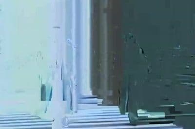 a blurry image of a building with a clock on it