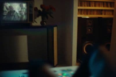 a blurry photo of a person playing a video game
