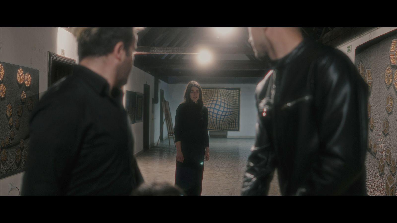 a group of people standing in a hallway