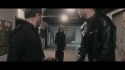 a group of people standing in a hallway