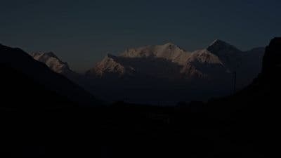a view of a mountain range at night