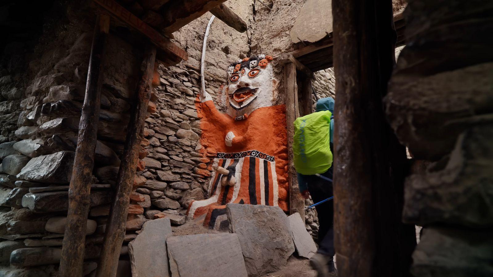 a statue of a person in a cave
