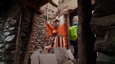 a statue of a person in a cave