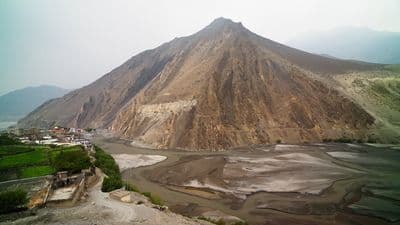 a mountain with a river running through it