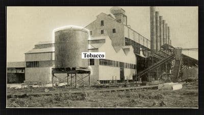a black and white photo of a factory