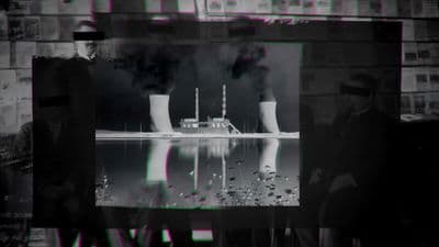 a black and white photo of a factory with smoke coming out of it