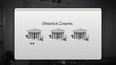 a black and white photo of a court building