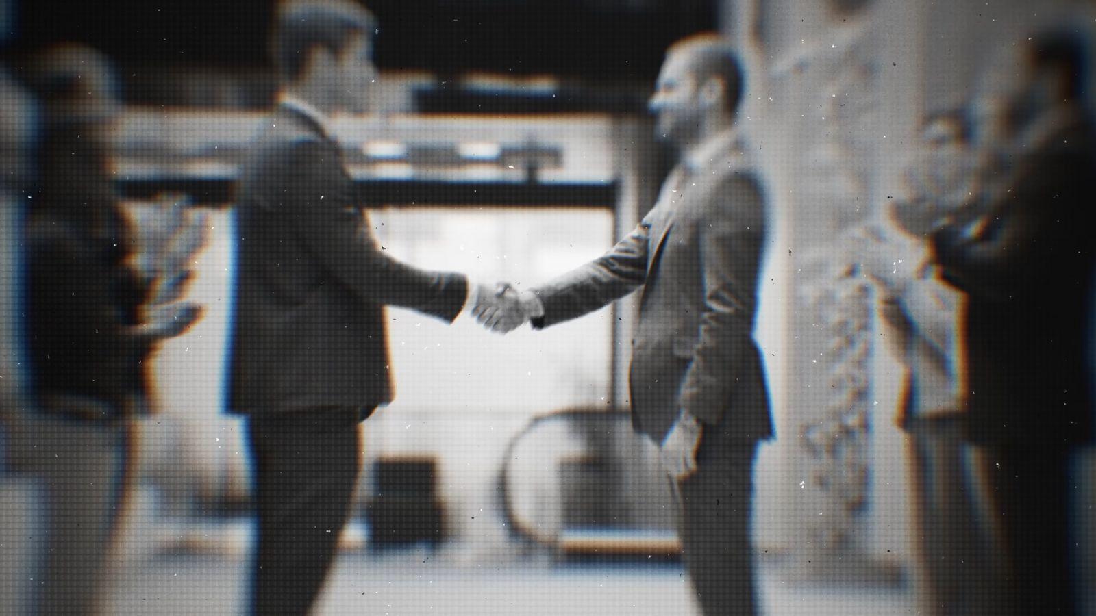a couple of men standing next to each other