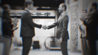 a couple of men standing next to each other