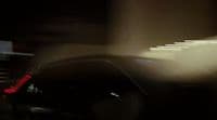 a blurry photo of a car driving down a street