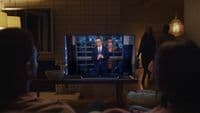 a group of people watching a television show