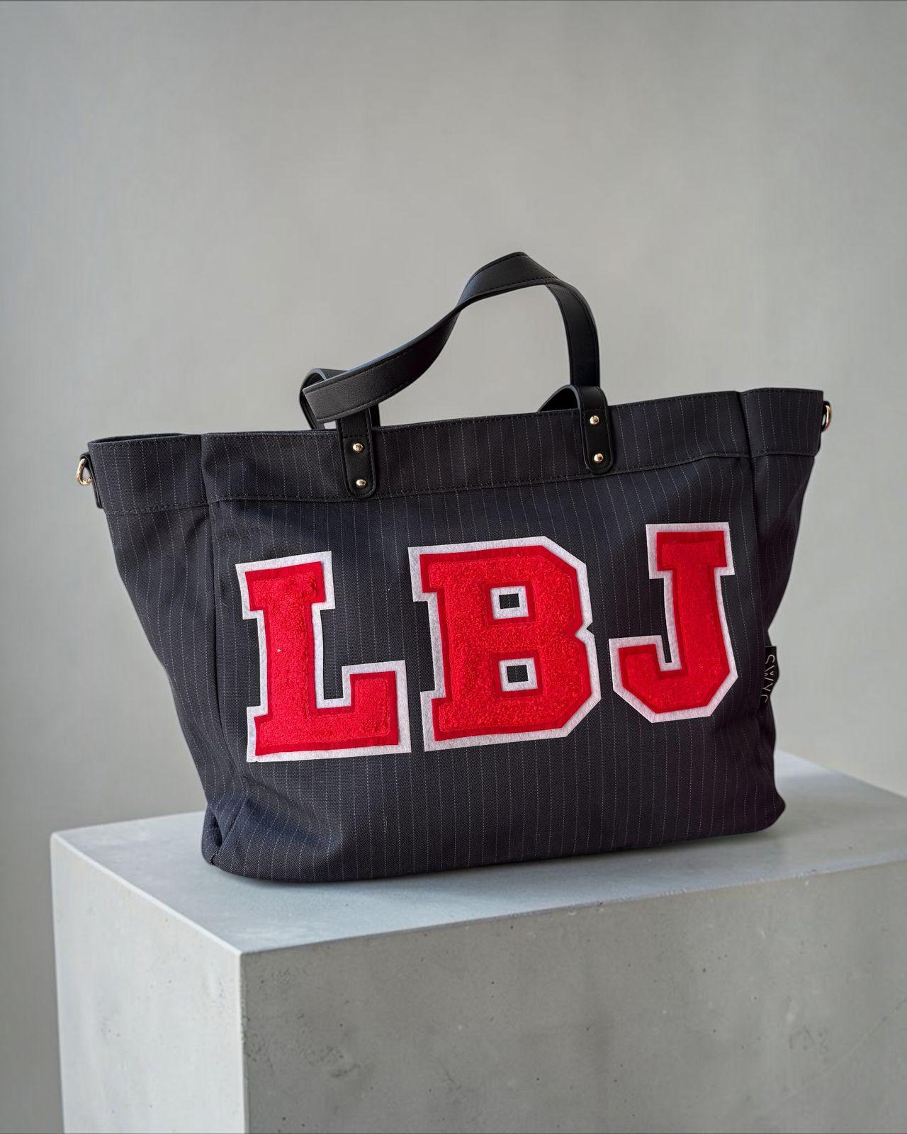 a black bag with red letters on it