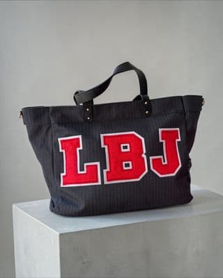 a black bag with red letters on it