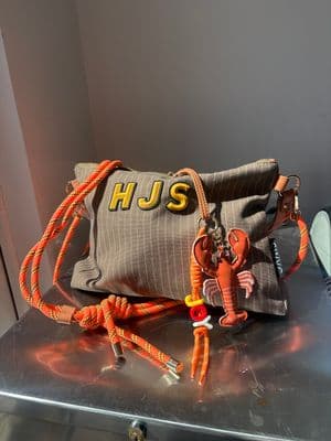 a purse sitting on top of a metal table