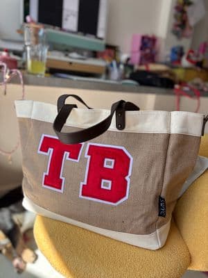 a bag with the number 18 on it sitting on a chair