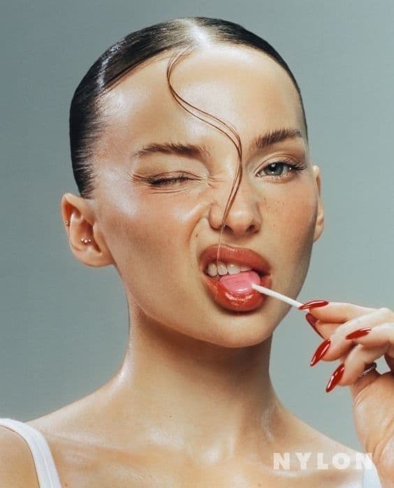 a woman with a cigarette in her mouth