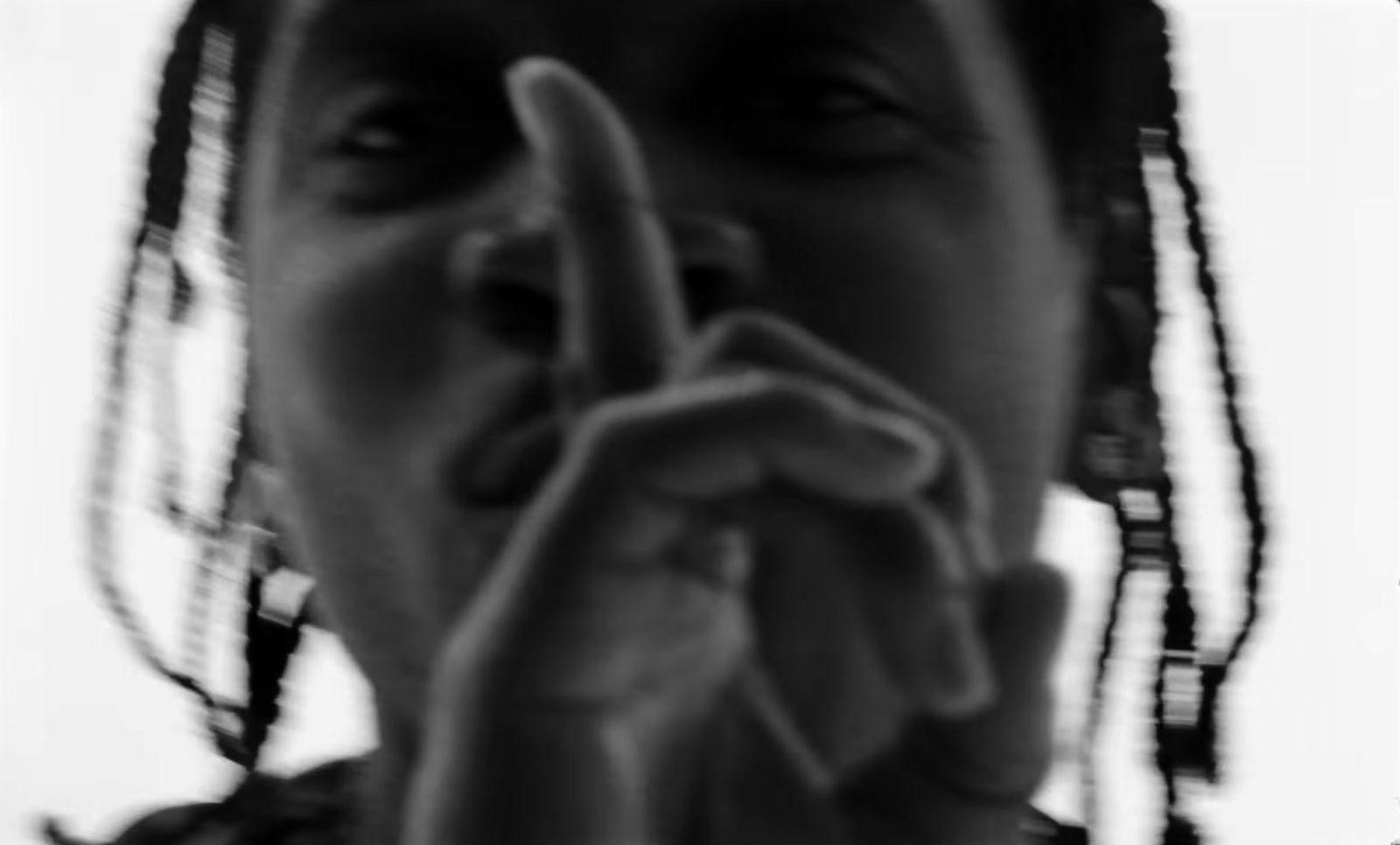 a woman making a hand sign with her fingers