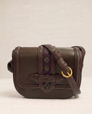 a brown purse with a gold ring on the handle