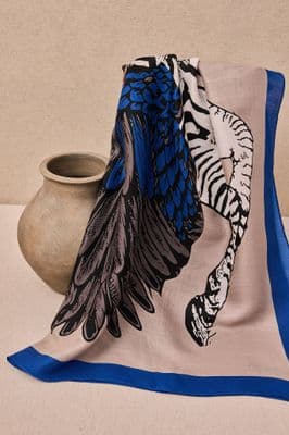a blue and white scarf sitting on top of a table