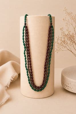 a close up of a necklace on a stand