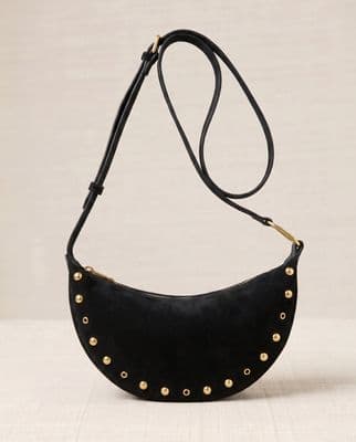 a black purse with gold studded details