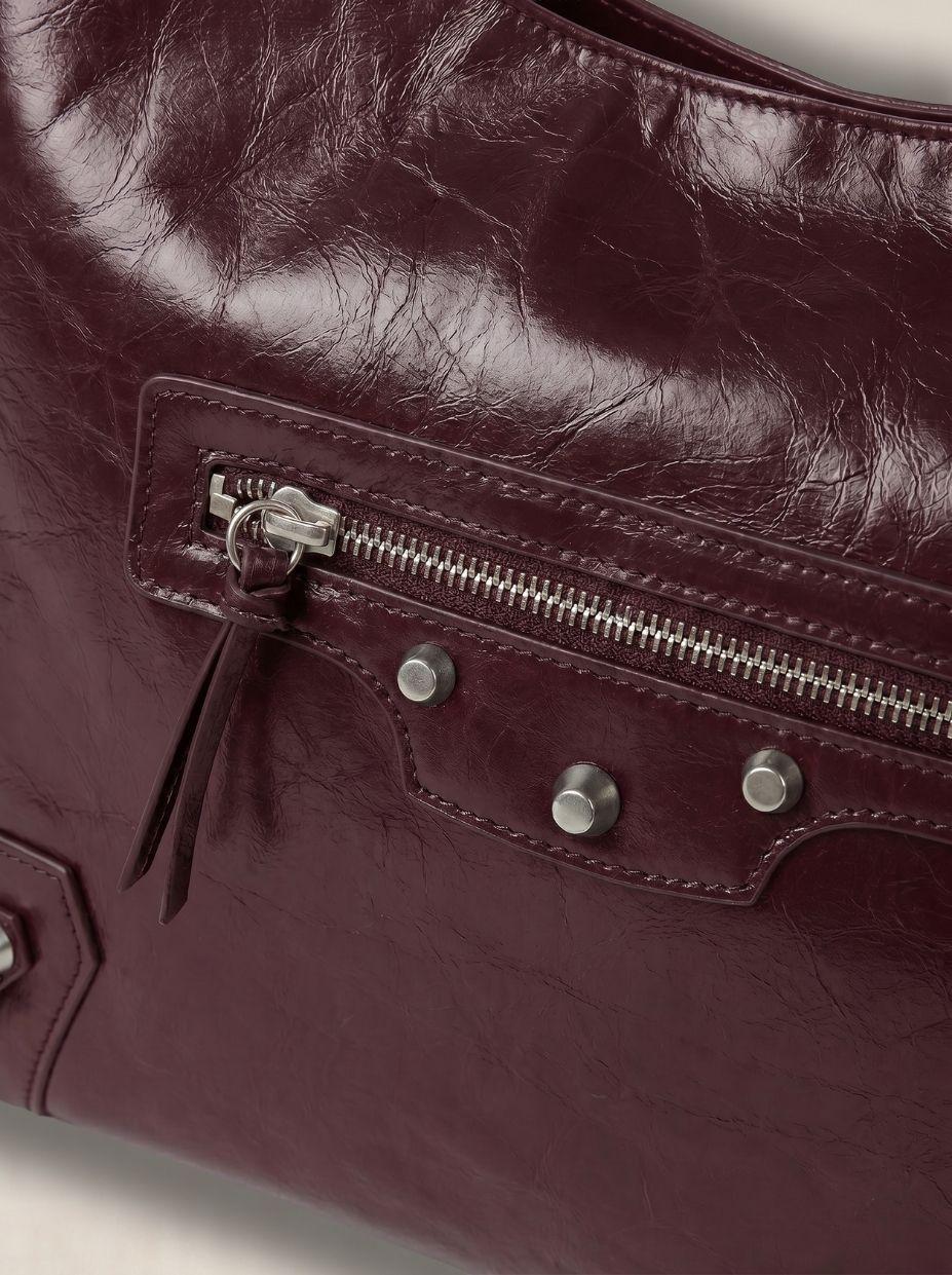a close up of a handbag with a zipper