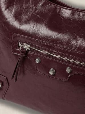 a close up of a handbag with a zipper