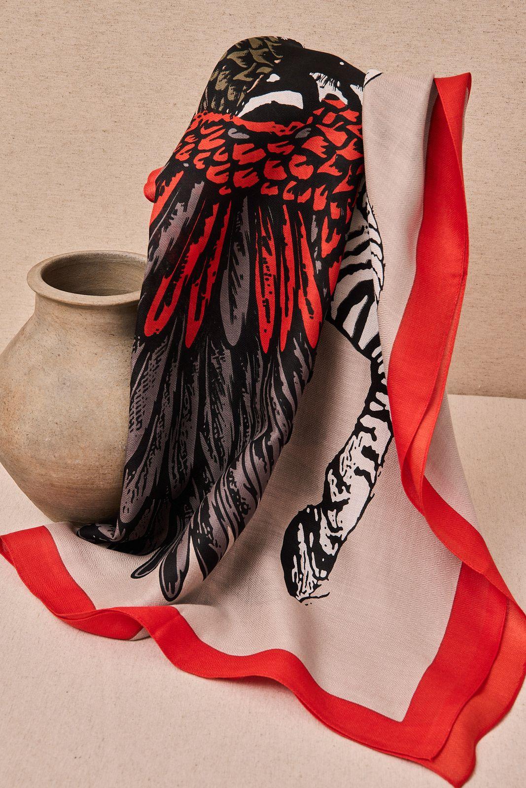 a vase with a red ribbon around it