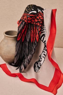 a vase with a red ribbon around it