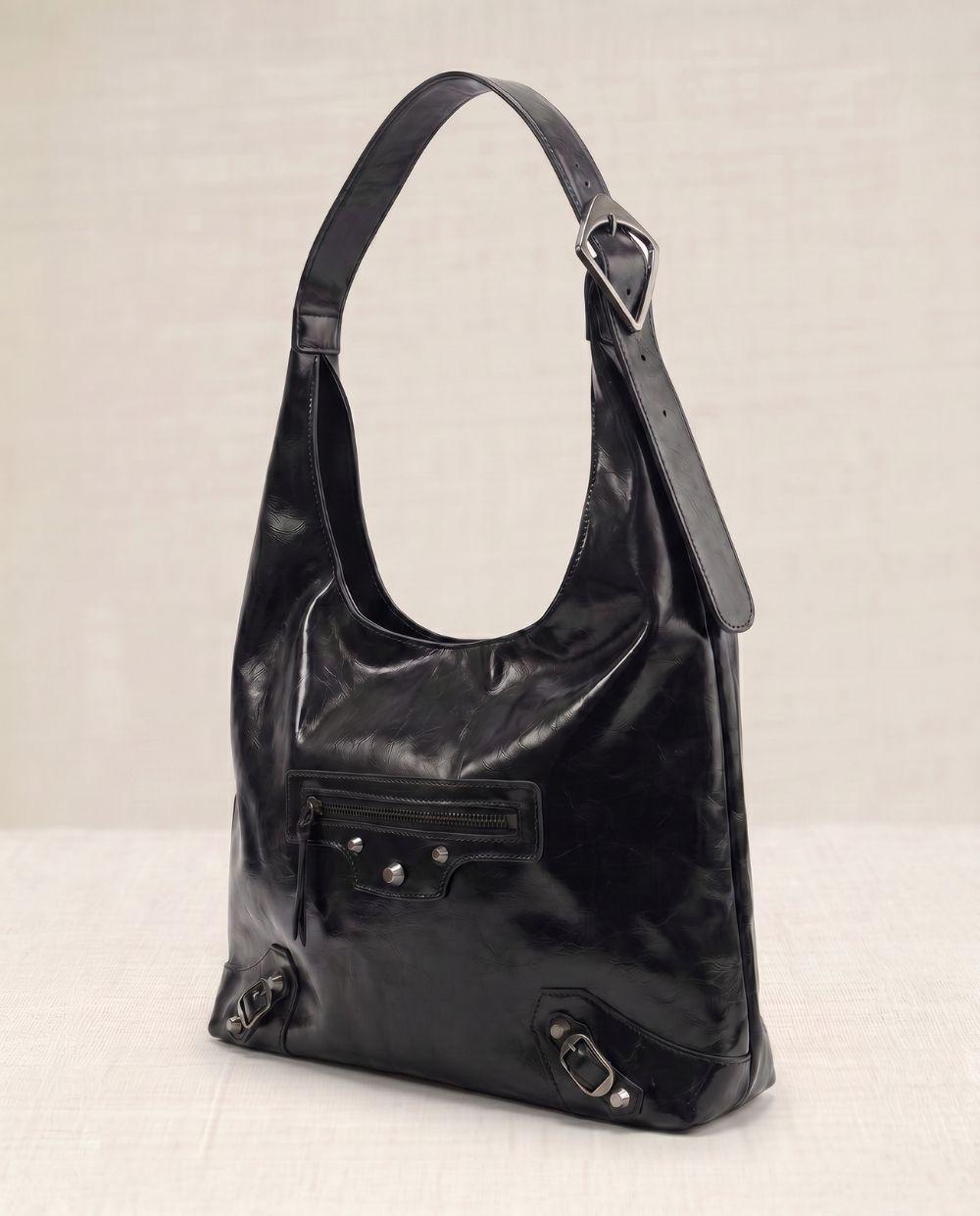 a black purse with a zipper on the front