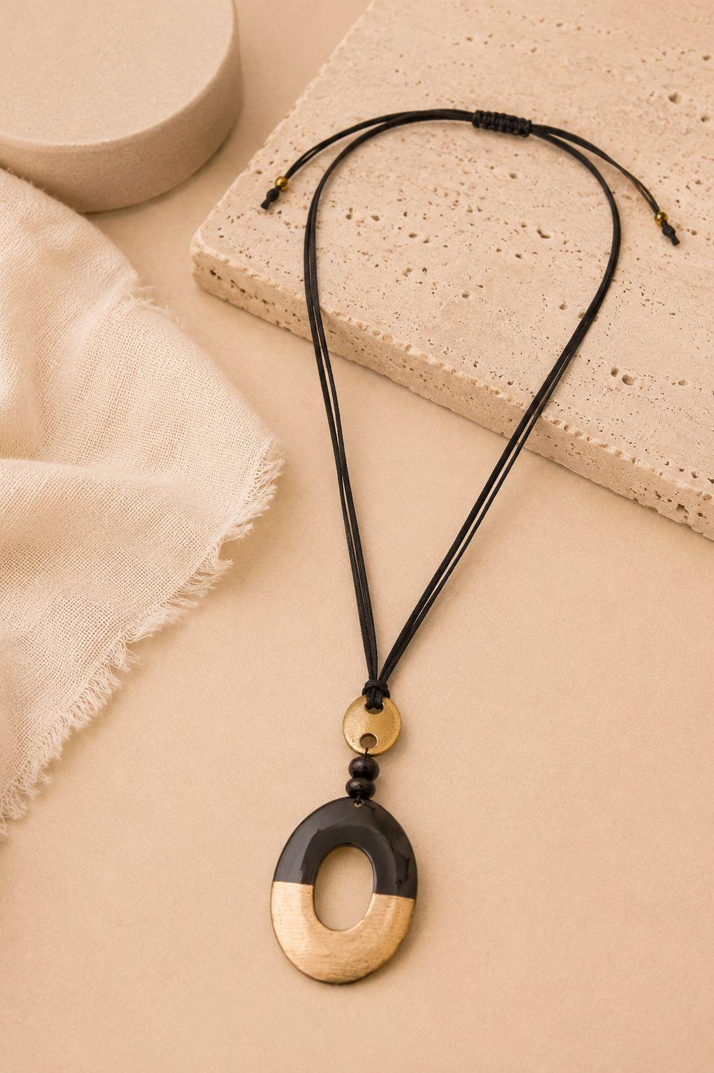 a close up of a necklace on a table