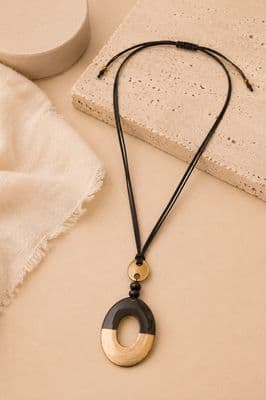 a close up of a necklace on a table