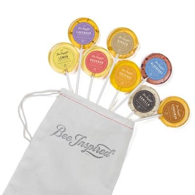 a bag filled with lollipops sitting on top of a table