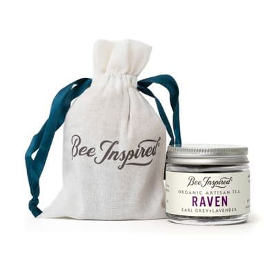 a jar of bee inspired organic artisan tea next to a drawstring bag