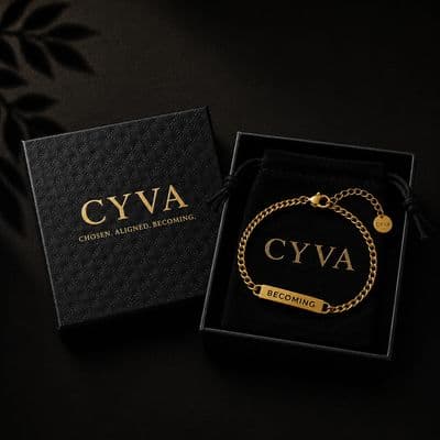a black box with a gold chain bracelet in it