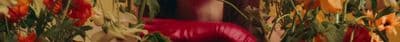 a blurry photo of a woman in a red dress