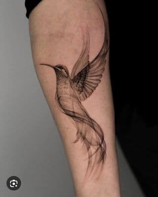 a tattoo of a hummingbird on the arm