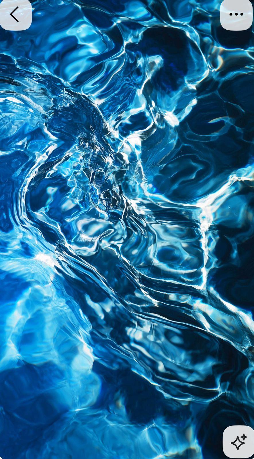 a close up of a cell phone with water