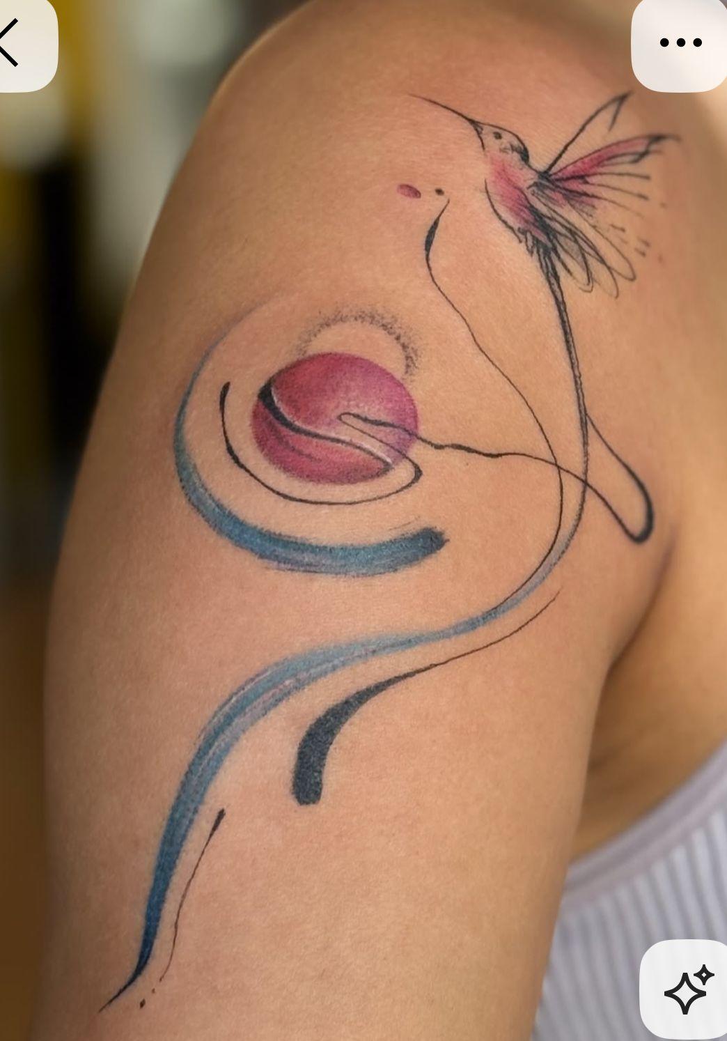 a woman with a tattoo on her arm