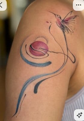 a woman with a tattoo on her arm