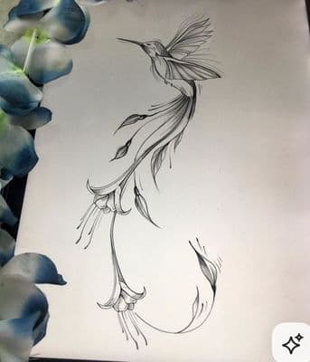a drawing of a hummingbird on a sheet of paper